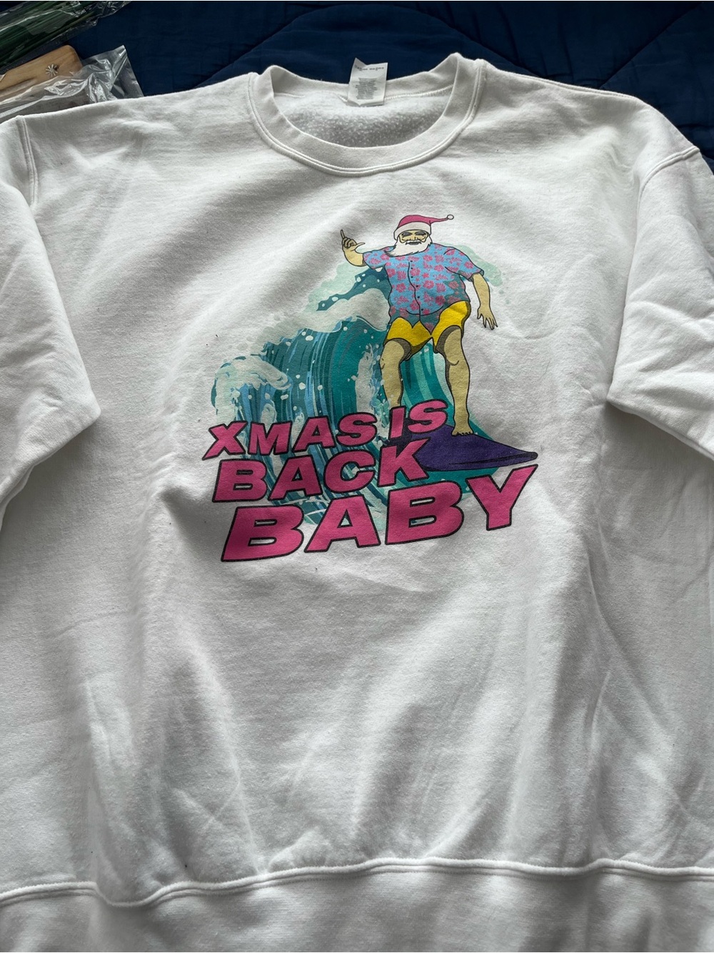 White Sweatshirt with Surfing Santa Graphic - "Xmas Is Back Baby"